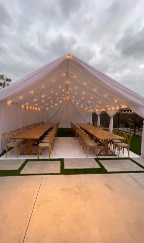 Spacious 12x30 luxury tent with flowing white drapery and pole covers for a high-end outdoor reception in Marina del Rey, Brentwood, or Pasadena.