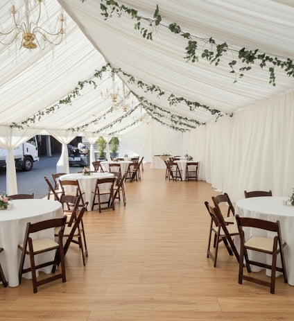 10x20 frame tent with decorative drapery and leg covers for a corporate mixer in Culver City.